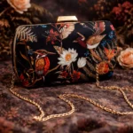 Elegant Bird & Floral Printed Clutch – Black Satin Finish with Golden Clasp